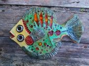 Hand-made ceramic painted plate in form fish