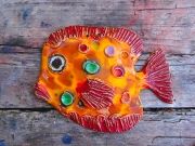 Hand-made ceramic painted plate in form fish