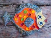 Hand-made ceramic painted plate in form fish