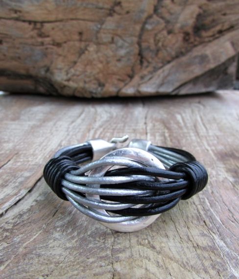 Hand-made leather bracelet of interwoven rows