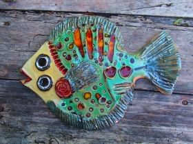 Hand-made ceramic painted plate in form fish