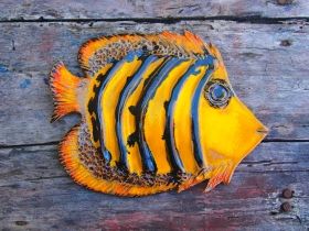 Hand-made ceramic painted plate in form fish