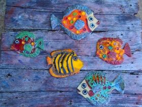 Hand-made ceramic painted plate in form fish