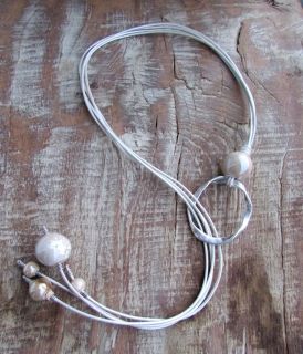 Long necklace with ceramic balls