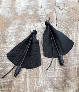 Extravagant earrings of genuine leather