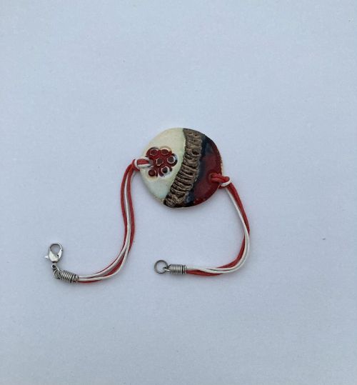 Hand-made woollen martenitsa with a ball