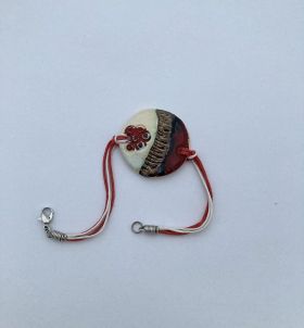 Hand-made woollen martenitsa with a ball